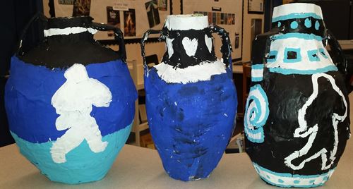Painted pots in an art class